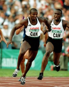 Canada's Donovan Bailey (foreground) and Bruny Surin compete in the men's 4x100m relay at the 1996 Atlanta Summer Olympic Games.(CP Photo/COA/ Claus Andersen) Donovan Bailey et Bruny Surin (de gauche à droite) du Canada participent au relais 4 x 100 m aux Jeux olympiques d'Atlanta de 1996. (Photo PC/AOC)
